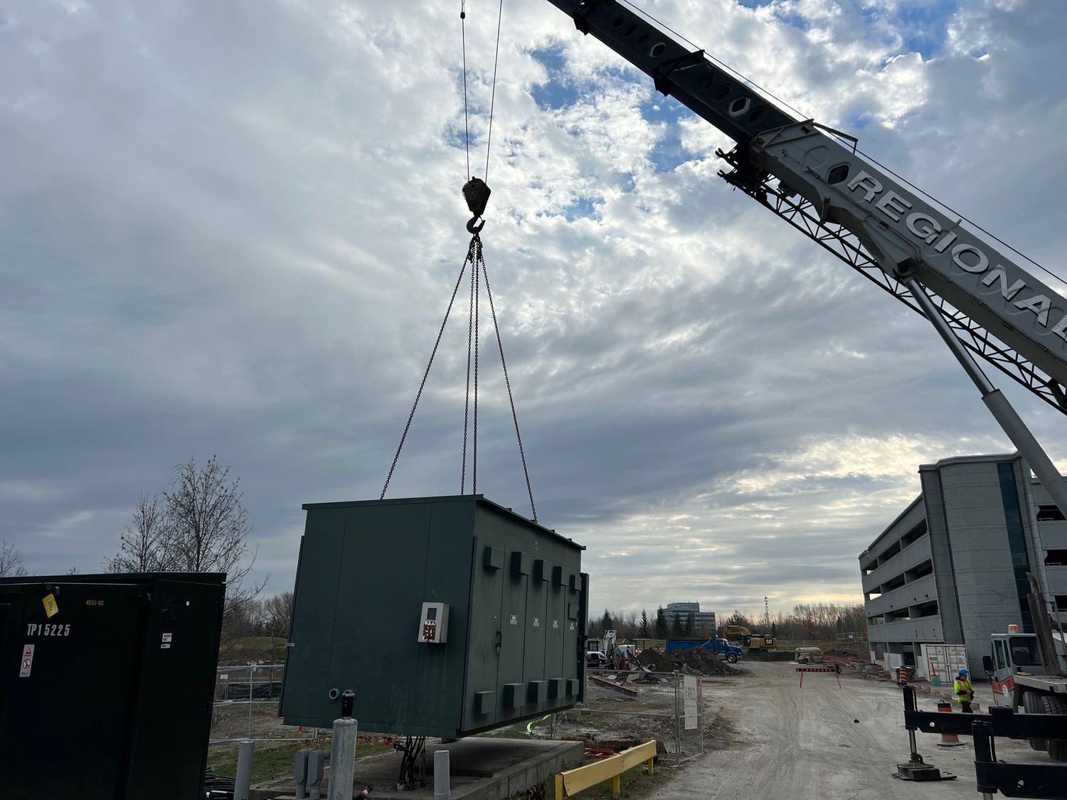 A crane lifting a 17,000 lb transformer