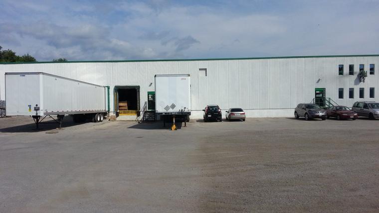 Trailers backed up to the loading docks at the back of the Orillia facility