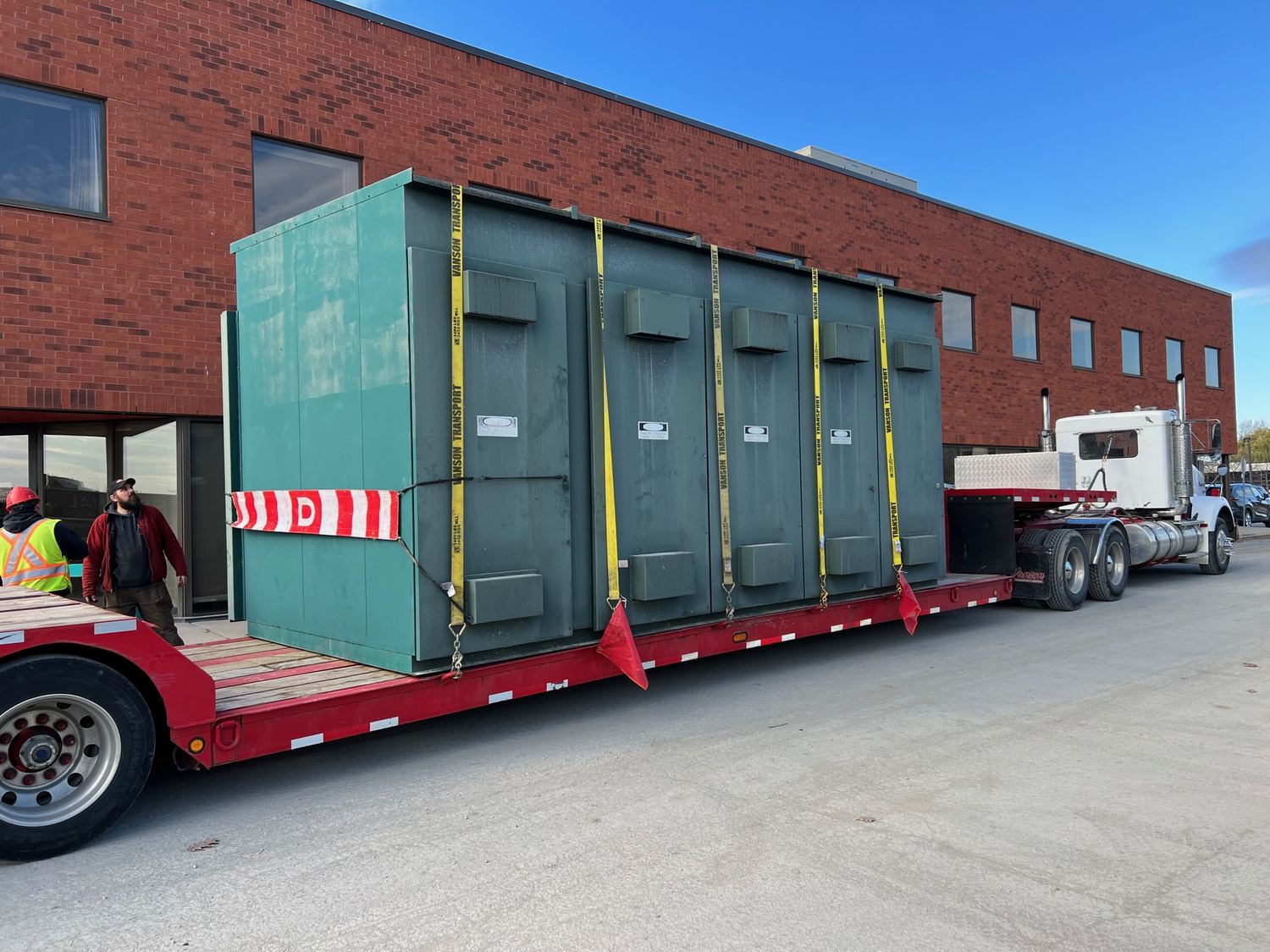 A 17,000 lb transformer strapped to a flatbed trailer