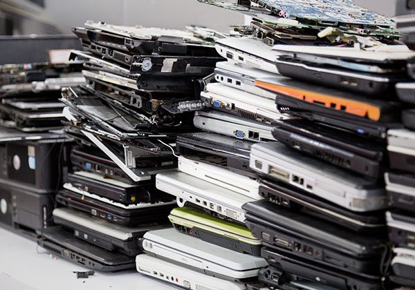 Stacks of retired laptops