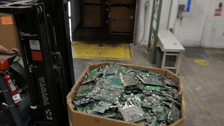 A box of circuit boards arriving on a forklift