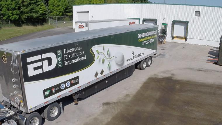 EDI's transport trailer backed up to the docks in Orillia, seen from above